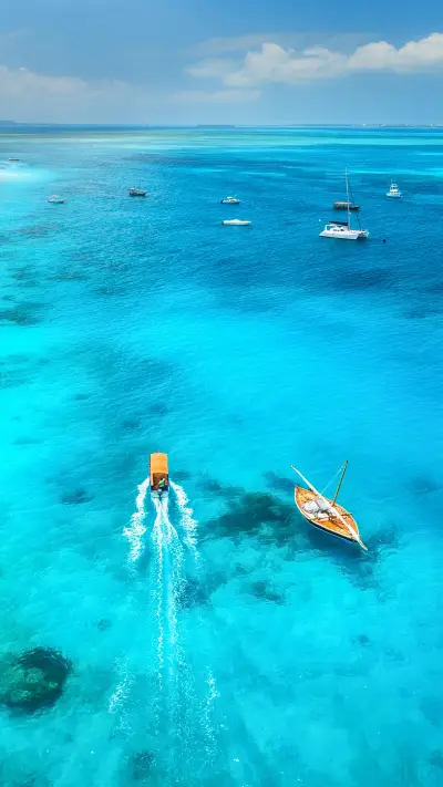 Fishing boats in clear blue water at sunny day in summer - Screenshot 1