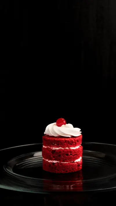 A vertical closeup shot of a plate with a red velvet pastry - Screenshot 1