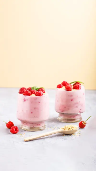 Yoghurt with raspberry and sesame in a glass