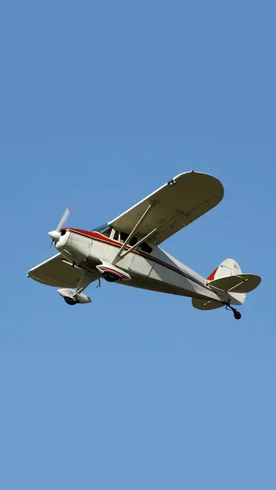 Private airplane fairchild m62a flying in clear blue sky - Screenshot 1