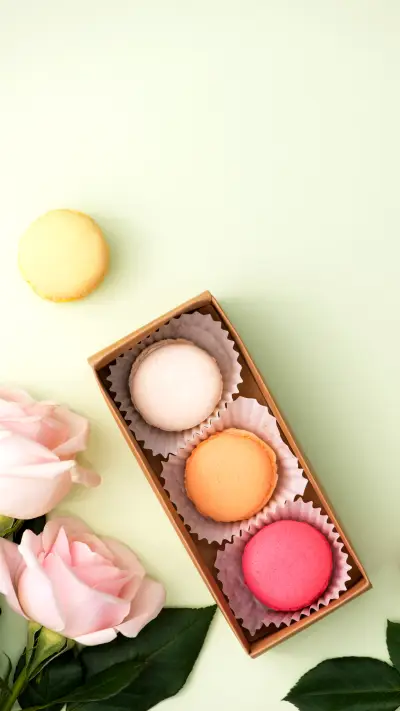 Many variegated sweet macarons in box