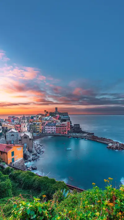 Panoramic view of the city of Vernazza at sunset