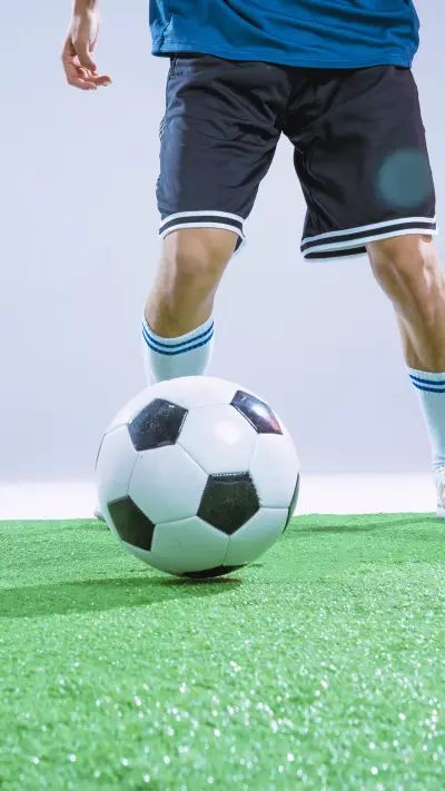 A football player dribbling the ball