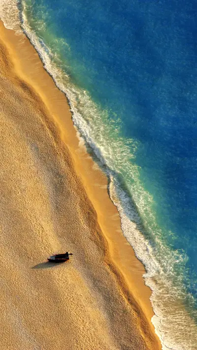 Lonely Boat on a Beach with Aerial View
