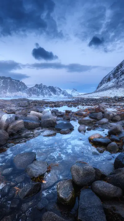 Seashore with stones and blurred water