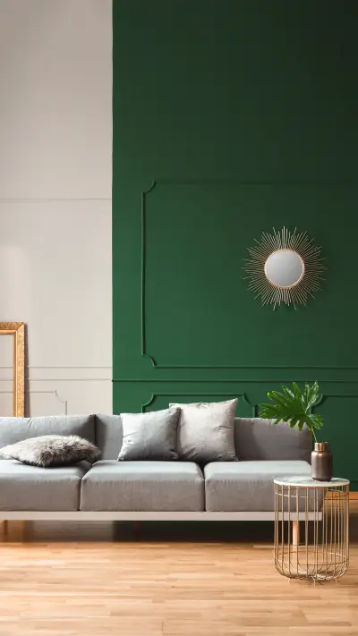 Green and grey wall with molding in chic living room