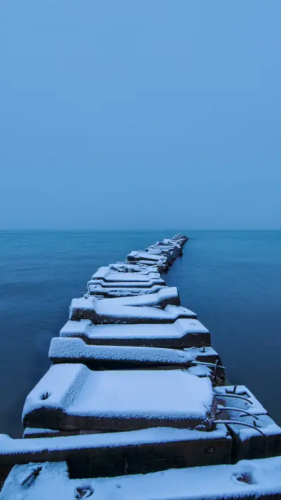 White jetty and blue sky