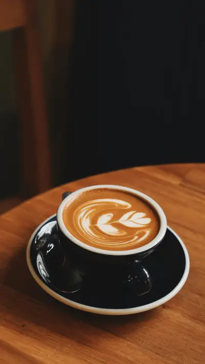 Coffee latte art on the wood desk in coffee shop cafe