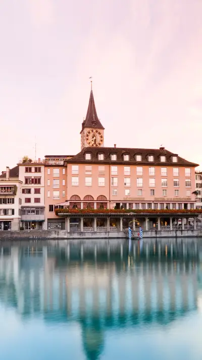 View over river limmat to hotel zum storchen and st peter