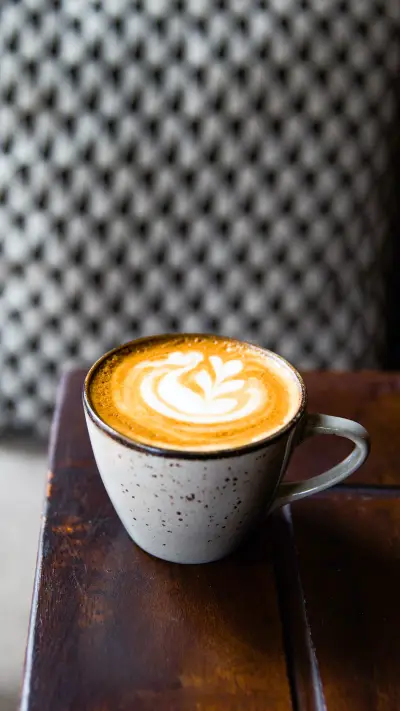Two Cups of hot cappuccino on wooden desk with spoons - Screenshot 1