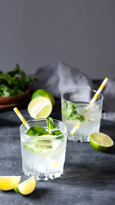 Two glasses of lime lemonade mojito