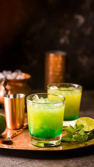 Orange Cocktail Decorated with Lime