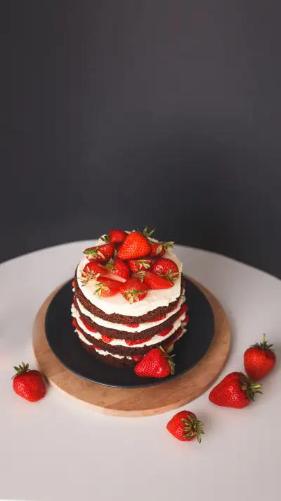 Strawberry cake with crust on dark background
