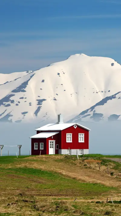 Iceland summer landscape. Fjord, house, mountains