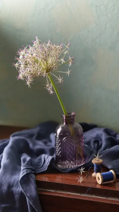 Flower in glass vase on vintage wooden table