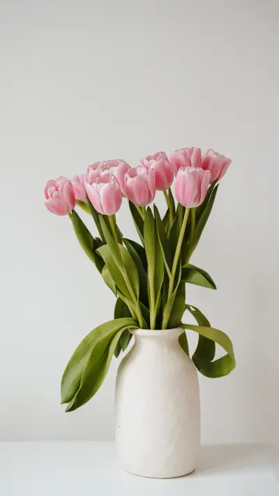 Elegant pink tulip flowers bouquet in clay vase