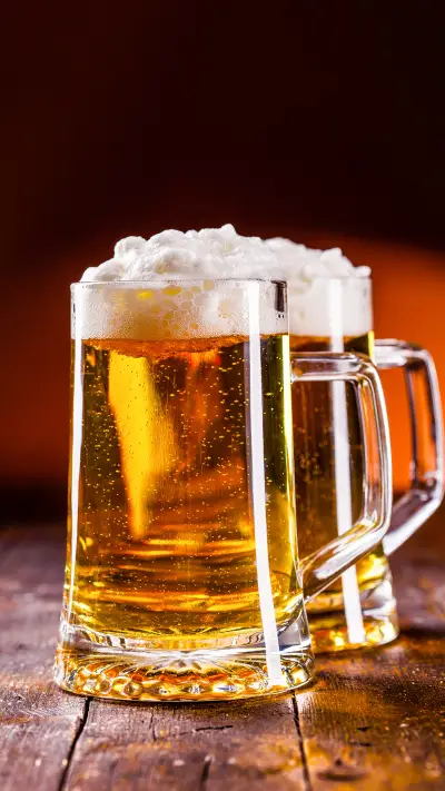 photo of traditional german beer glass on wooden table