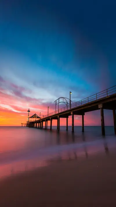 A vibrant sunset at Brighton Jetty in Brighton