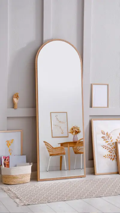 Light Room Interior with Large Mirror and Beautiful Pictures
